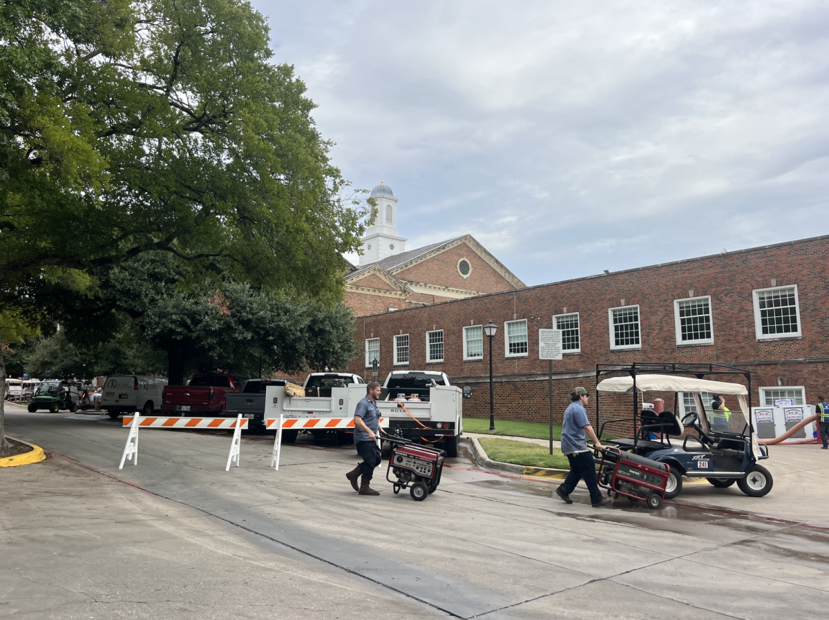 Crews cart generators into Umphrey Lee.